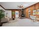 Living space with hardwood floors, stone fireplace, skylight, wood walls, and open dining space at 41 Silver Spruce, Boulder, CO 80302