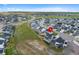 Drone view of home's location within the community, with well-maintained yards and open spaces at 1172 Elbridge Cir, Elizabeth, CO 80107