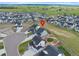 Aerial view of a neighborhood showcasing the home's location and surrounding lush greenery and open spaces at 1172 Elbridge Cir, Elizabeth, CO 80107