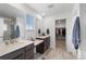 Bathroom with a double vanity, walk-in shower, and modern fixtures at 1172 Elbridge Cir, Elizabeth, CO 80107