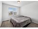 Bright bedroom featuring a large window with blinds and a plush bed, creating a serene atmosphere at 1172 Elbridge Cir, Elizabeth, CO 80107