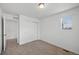 Cozy bedroom featuring neutral carpet, a closet with sliding doors, and a window letting in natural light at 1172 Elbridge Cir, Elizabeth, CO 80107