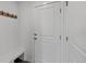 Bright entryway features coat hooks, a built-in bench, and a paneled door, creating a welcoming space at 1172 Elbridge Cir, Elizabeth, CO 80107