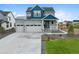 Charming two-story home featuring a spacious three car garage and quaint front porch at 1172 Elbridge Cir, Elizabeth, CO 80107