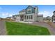 Two-story home featuring a well-maintained lawn, blue accents, and a charming porch at 1172 Elbridge Cir, Elizabeth, CO 80107
