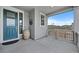 Covered front porch with views of the exterior landscaping at 1172 Elbridge Cir, Elizabeth, CO 80107