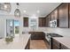 Spacious kitchen featuring white countertops, stainless appliances, and dark wood cabinetry at 1172 Elbridge Cir, Elizabeth, CO 80107