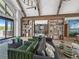 Modern living room featuring wood beams, stylish decor, and exterior access at 1172 Elbridge Cir, Elizabeth, CO 80107