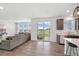 Bright living space with a large window and sliding door leading to the backyard at 1172 Elbridge Cir, Elizabeth, CO 80107