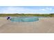 Community outdoor pool featuring lounge chairs and a relaxing environment at 1172 Elbridge Cir, Elizabeth, CO 80107