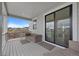 Comfortable porch area with wicker furniture and sliding glass door, perfect for relaxing and enjoying the outdoor view at 1172 Elbridge Cir, Elizabeth, CO 80107