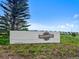 Community sign in a landscaped area with view of homes in the background at 1172 Elbridge Cir, Elizabeth, CO 80107