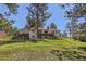 Expansive backyard with a large deck, patio, and lush lawn perfect for outdoor activities and relaxation at 5583 Thunder Hill Rd, Parker, CO 80134
