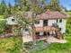 Lovely backyard featuring a deck with seating, a patio, mature landscaping, and a large shade tree at 5583 Thunder Hill Rd, Parker, CO 80134