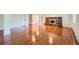 Spacious basement featuring hardwood floors, a fireplace, and a doorway at 5583 Thunder Hill Rd, Parker, CO 80134