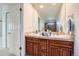 Bathroom vanity with double sinks and a large mirror at 5583 Thunder Hill Rd, Parker, CO 80134
