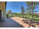 Deck overlooking green space with black railing, and wooden flooring at 5583 Thunder Hill Rd, Parker, CO 80134