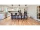 Modern kitchen with an island, breakfast bar seating, and stainless steel appliances at 5583 Thunder Hill Rd, Parker, CO 80134