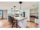 Updated kitchen featuring an island with a breakfast bar, a skylight and modern appliances at 5583 Thunder Hill Rd, Parker, CO 80134
