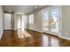 Cozy bedroom featuring hardwood floors, a closet, natural light, and access to the backyard at 5500 Holland Dr, Arvada, CO 80002