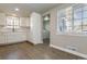 Bright kitchen with white cabinets, stainless steel appliances, and gray tile flooring at 5500 Holland Dr, Arvada, CO 80002