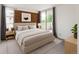 Bedroom with balcony access, brick accent wall and an abundance of natural light at 850 20Th St # 201, Boulder, CO 80302