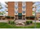 Building entrance featuring attractive landscaping, a welcoming entrance, and reserved parking spaces at 850 20Th St # 201, Boulder, CO 80302