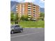 Exterior view highlighting the apartment building's architecture and scenic views with ample parking at 850 20Th St # 201, Boulder, CO 80302