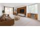 Living room with brick accent wall, sliding glass doors to balcony, and neutral decor at 850 20Th St # 201, Boulder, CO 80302