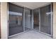 Open patio with glass sliding doors leading to the living area, offering seamless indoor-outdoor living at 850 20Th St # 201, Boulder, CO 80302