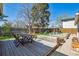 Large backyard featuring a wood deck, raised garden beds, and a spacious lawn at 3725 S Acoma St, Englewood, CO 80110