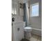 Cozy bathroom with tub, white vanity, and tiled floors at 3725 S Acoma St, Englewood, CO 80110