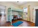 Bright bedroom with a lofted twin bed, hardwood floors, and lots of natural light at 3725 S Acoma St, Englewood, CO 80110