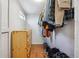 Walk-in closet with custom storage solutions and wood laminate flooring at 3725 S Acoma St, Englewood, CO 80110