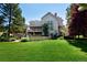 Expansive backyard with a patio, balcony, and lush landscaping, perfect for outdoor living at 4845 S Gaylord St, Cherry Hills Village, CO 80113
