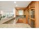 Basement bar with wine storage, granite counters, and views of the rec room at 4845 S Gaylord St, Cherry Hills Village, CO 80113