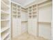 Spacious walk-in closet features custom shelving and drawers at 4845 S Gaylord St, Cherry Hills Village, CO 80113
