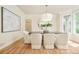 Dining room featuring wood floors, a modern chandelier, large windows and bright natural light at 4845 S Gaylord St, Cherry Hills Village, CO 80113