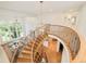 Grand foyer featuring a curved staircase, high ceilings, and lots of natural light at 4845 S Gaylord St, Cherry Hills Village, CO 80113