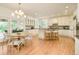 Spacious eat-in kitchen with granite countertops, center island, and stainless steel appliances at 4845 S Gaylord St, Cherry Hills Village, CO 80113