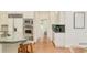Kitchen featuring wood floors, granite counters, stainless steel appliances, and white cabinets at 4845 S Gaylord St, Cherry Hills Village, CO 80113