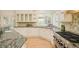 Well-lit kitchen with granite countertops, and stainless steel appliances at 4845 S Gaylord St, Cherry Hills Village, CO 80113