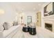 Beautiful living room with fireplace, neutral furniture, and stylish decor at 4845 S Gaylord St, Cherry Hills Village, CO 80113