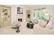 Bright living room featuring neutral decor, a fireplace, and access to the outdoor at 4845 S Gaylord St, Cherry Hills Village, CO 80113