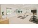 Bright workout room featuring a mirrored wall, exercise equipment, and large windows at 4845 S Gaylord St, Cherry Hills Village, CO 80113
