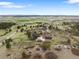 Lovely aerial shot of the property and its expansive acreage with mountain views in the distance at 7465 Kelty Trl, Franktown, CO 80116