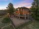Beautiful home with a large deck and covered patio area, perfect for outdoor entertaining at 7465 Kelty Trl, Franktown, CO 80116