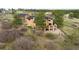 Aerial view showcasing the home's back deck, mature trees, and landscaping in a serene setting at 7465 Kelty Trl, Franktown, CO 80116