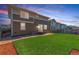 Picturesque backyard featuring a vibrant lawn, modern house, and inviting outdoor space for leisure and entertainment at 1933 Griffin Dr, Brighton, CO 80601