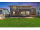 Expansive backyard showcasing lush green grass and a modern two-story home, creating a perfect outdoor space at 1933 Griffin Dr, Brighton, CO 80601